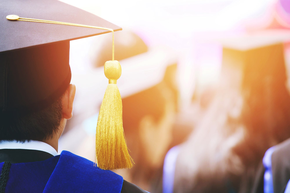 Student at Graduation with their cap tassel hanging to the right side
