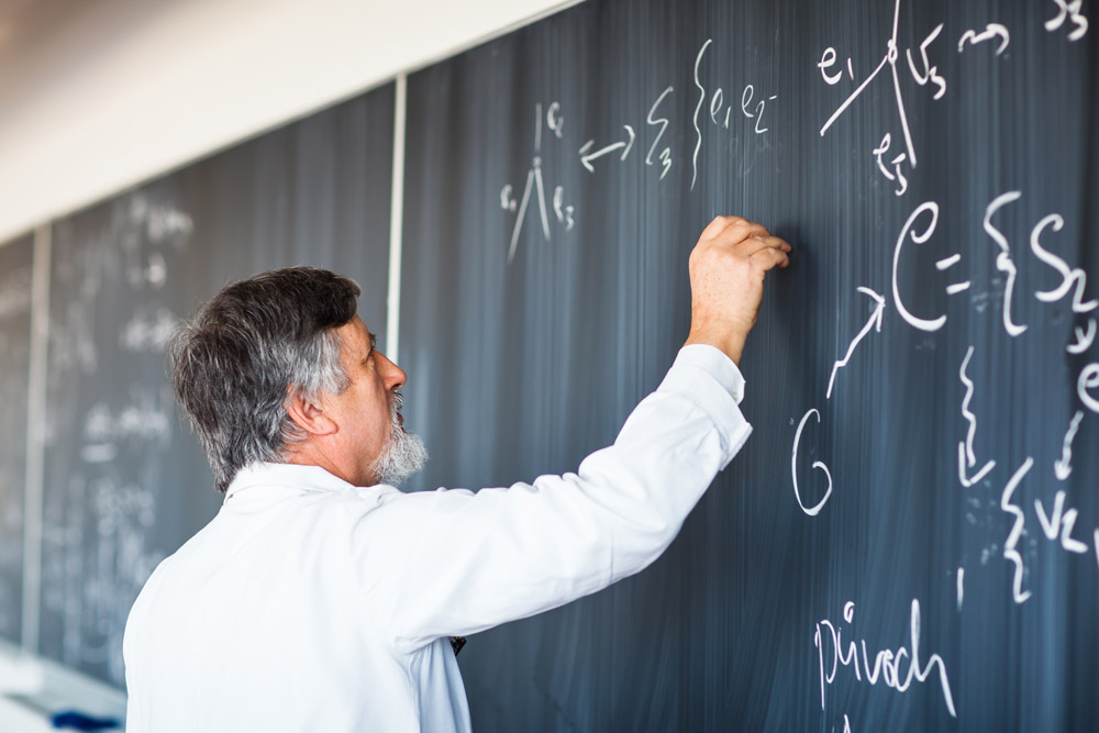 Professor drawing on a chalkboard